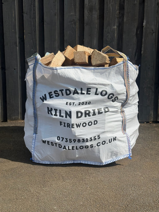 Tonne Bag of Kiln Dried Firewood sat in front of barn door